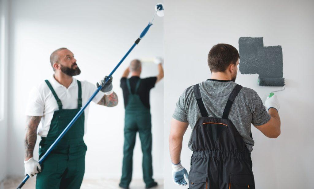 Professional renovation crew painting walls of a new build apartment