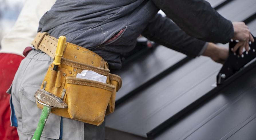 Construction worker doing his job with belt