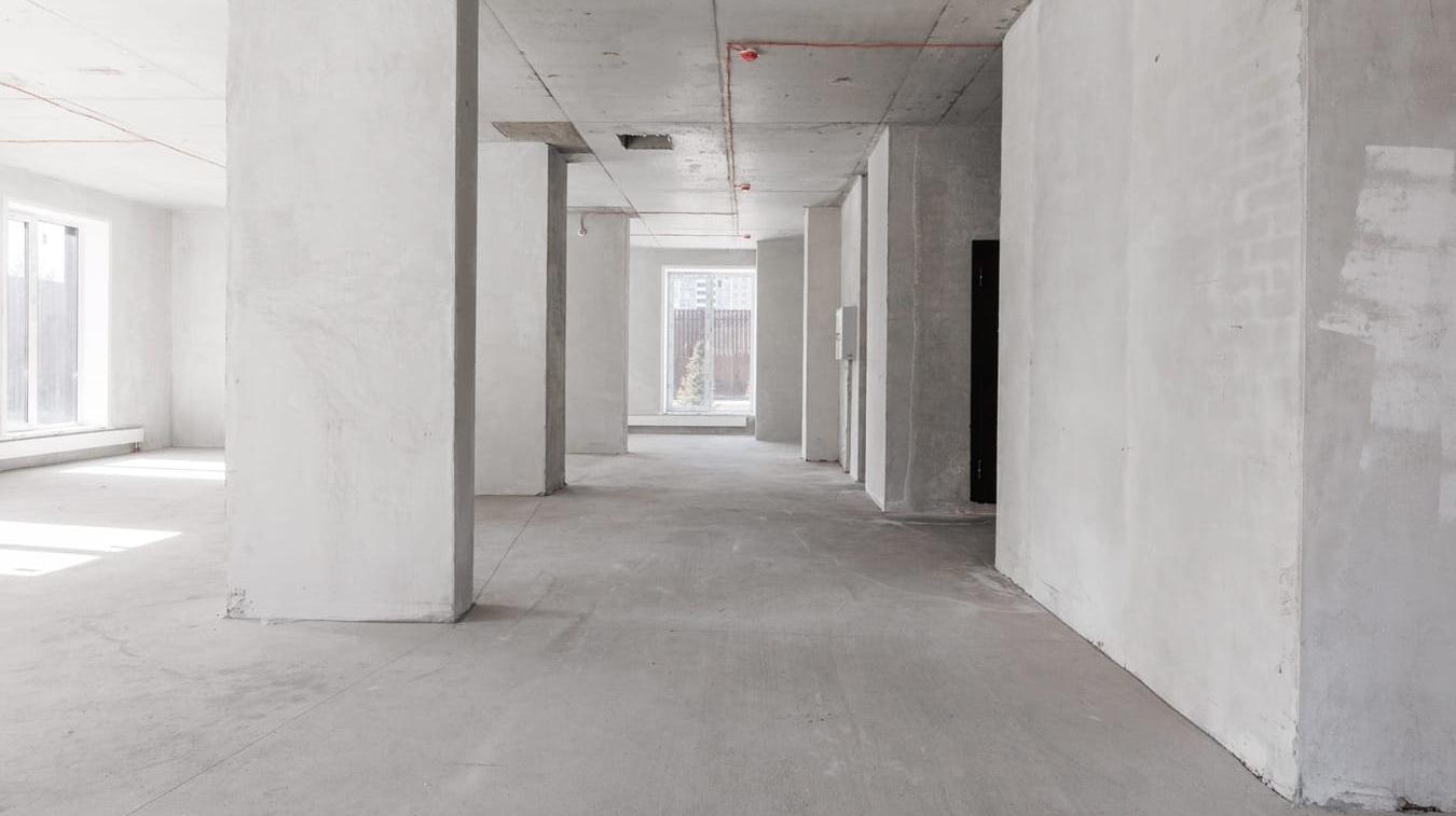 Interior of the apartment without decoration in gray colours rough finish