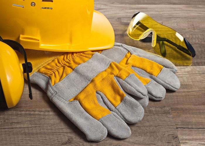 preparing workspace with safety goggles and gloves