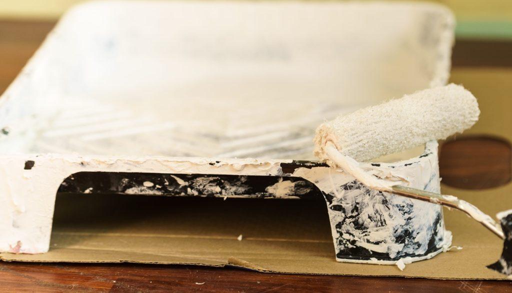 White paint with essential painting equipment